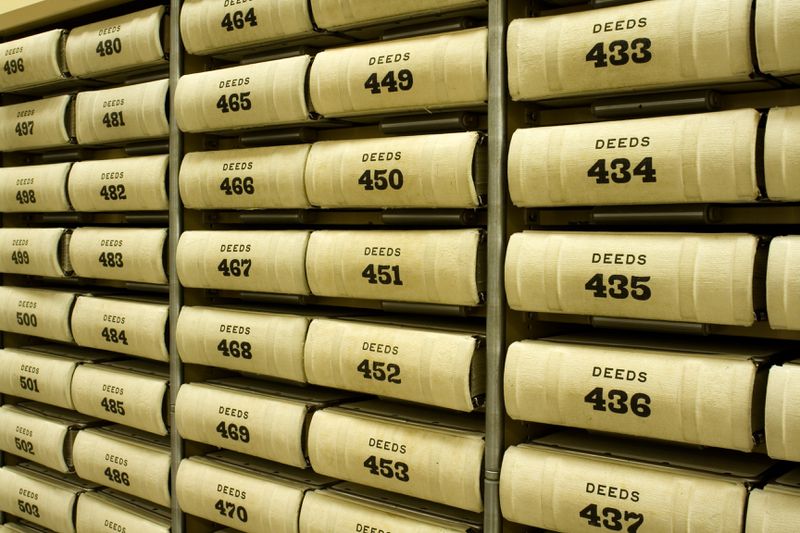 A shelf full of numbered deeds