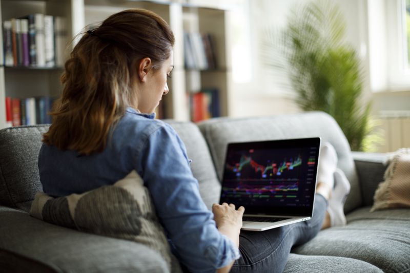 Woman trading on her laptop
