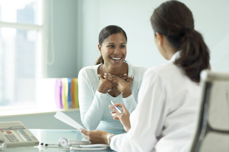 Woman talking to her doctor.
