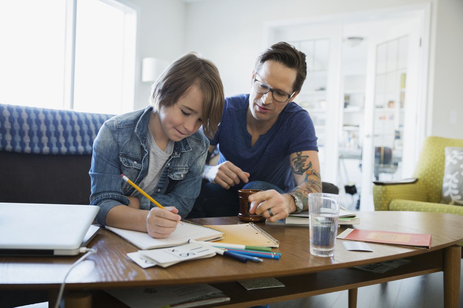 Kid working on homework with parent