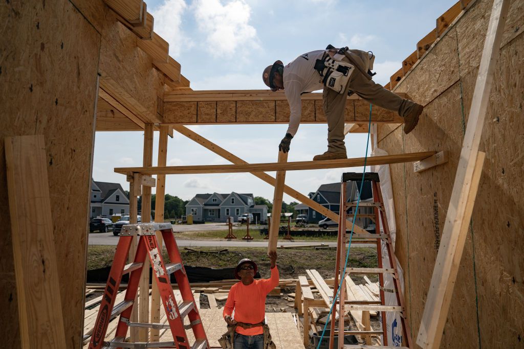 Workers build homes in Lillington, North Carolina, US, on Thursday, June 15, 2023.