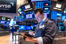 Traders work on the floor of the New York Stock Exchange 
