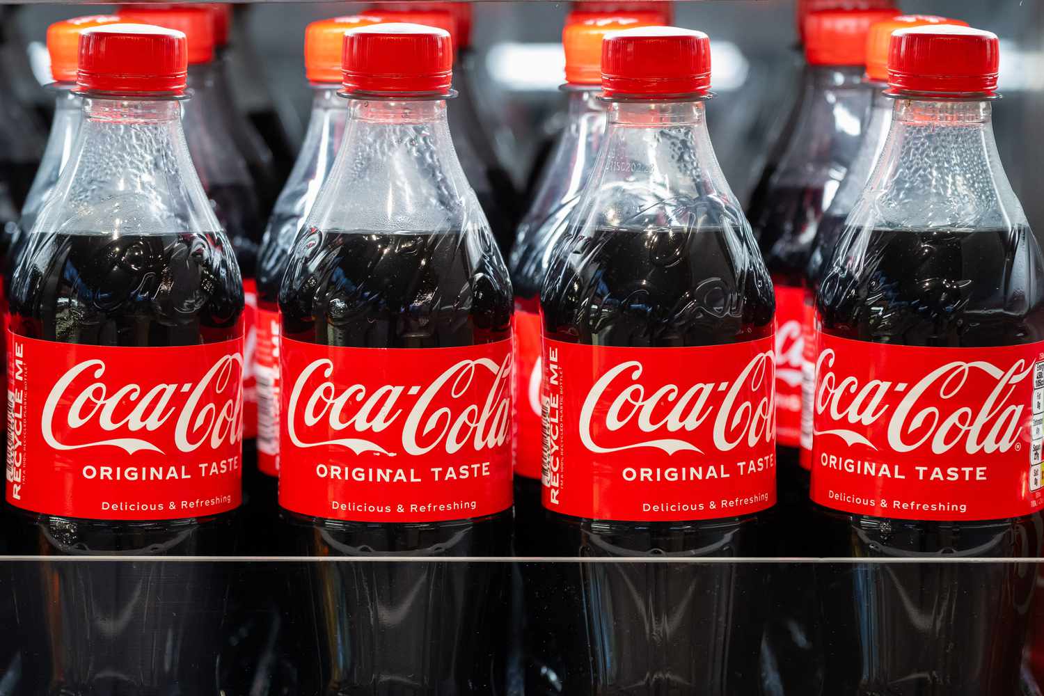 Bottles of Coca Cola on sale in a supermarket.