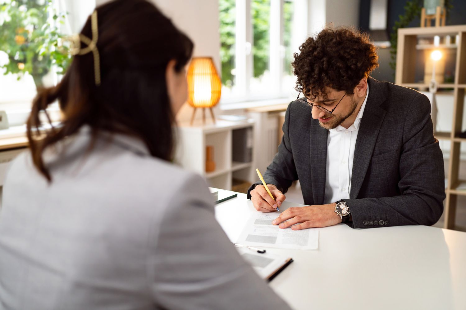Man works with a lender during a refinance wave