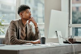 Employee researching on a computer how his company's Flexible Spending Account works
