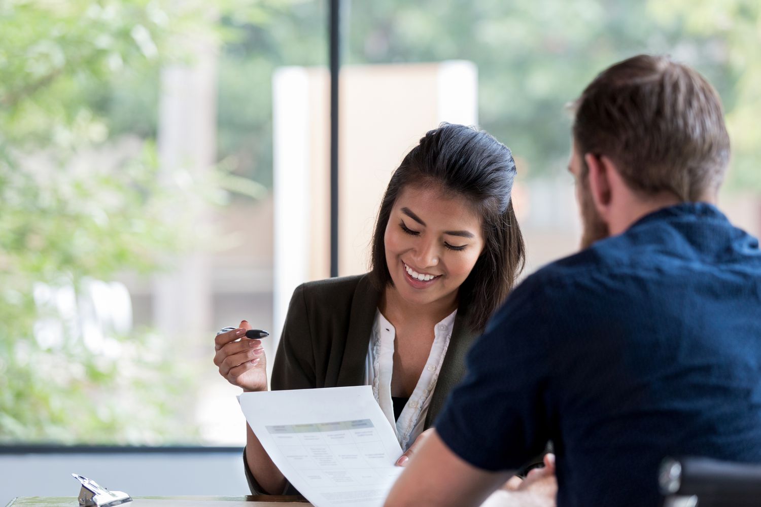 Woman signing documents