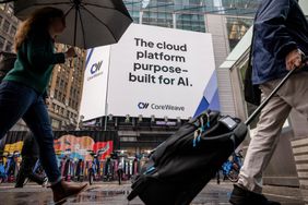 Street view with pedestrians passing under an advertisement for CoreWeave, describing it as an AI-purpose cloud platform