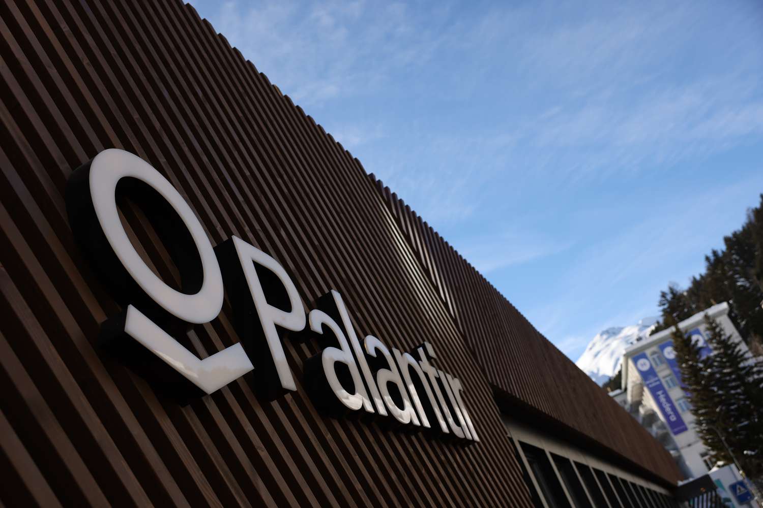 The Palantir logo on display at an event.