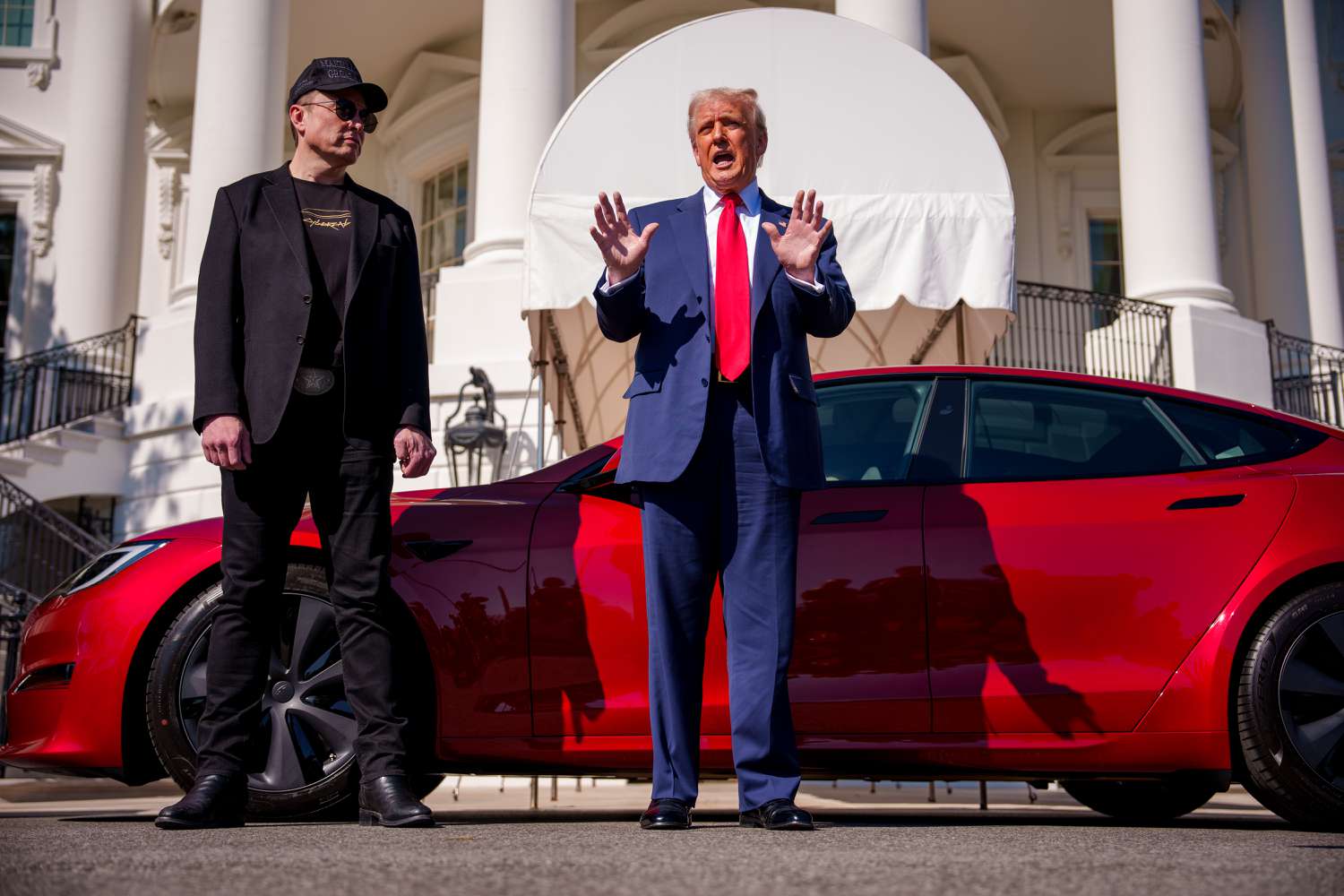 President Trump and Elon Musk with a Tesla on the White House lawn in March. 