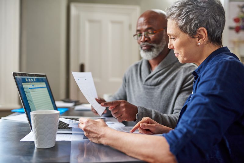 senior couple looking at finances