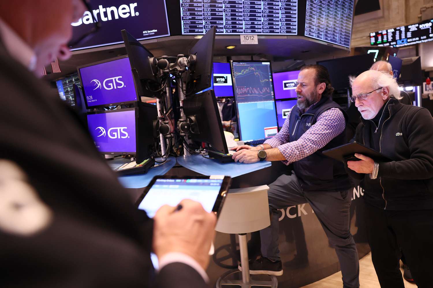 Traders work on the floor of the New York Stock Exchange during morning trading on March 14, 2025 in New York City. 