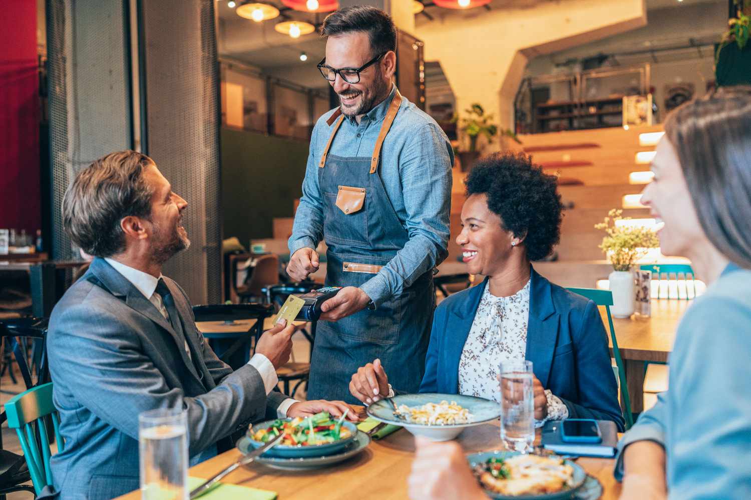 A businessman paying for a lunch
