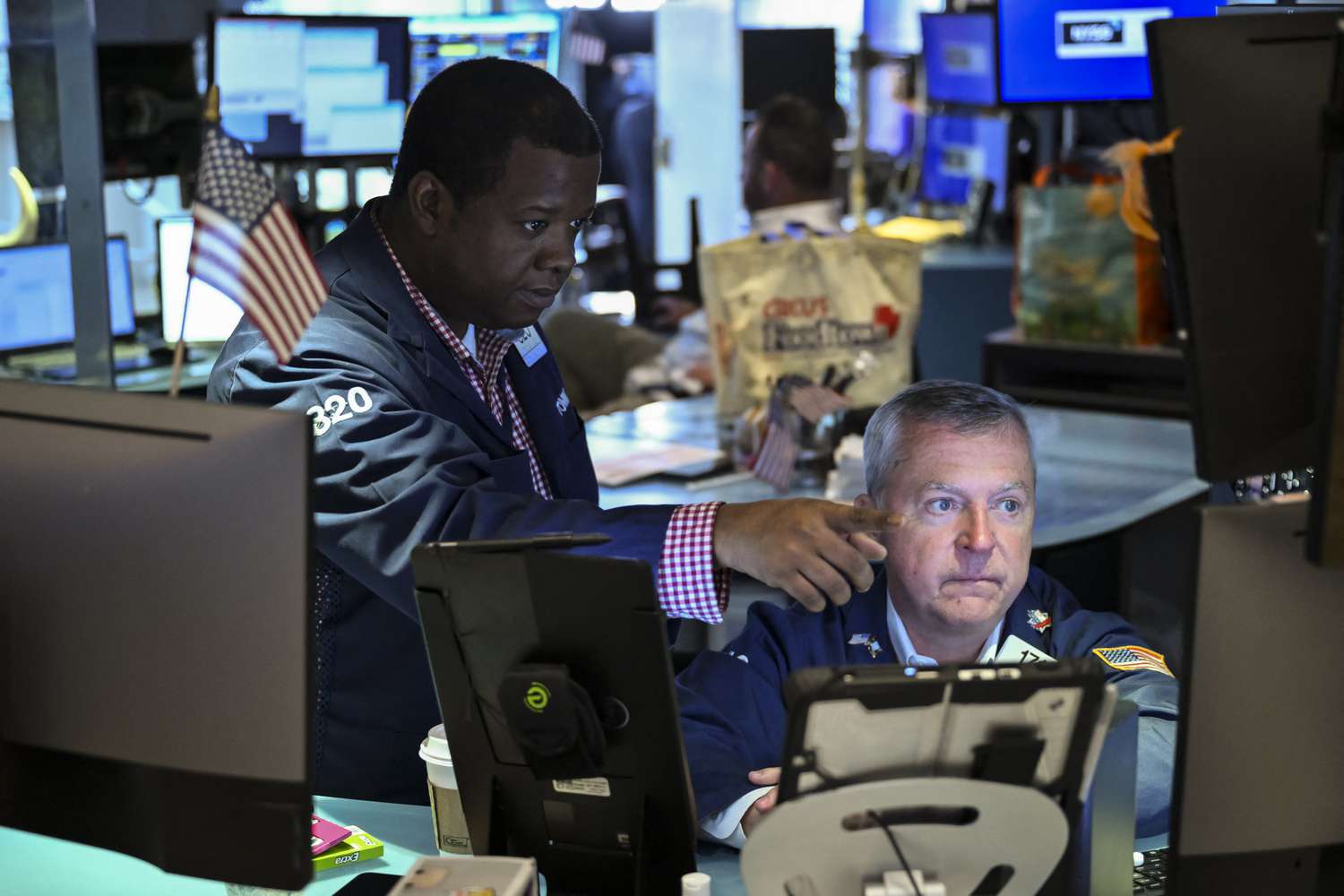 Two traders working on the floor on the New York Stock Exchange. 