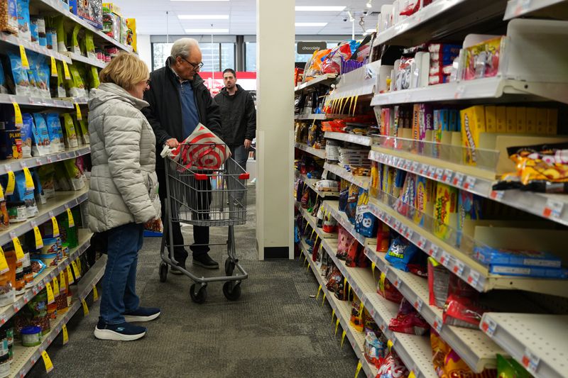 Customers shop at a supermarket on March 12, 2025 in New York City