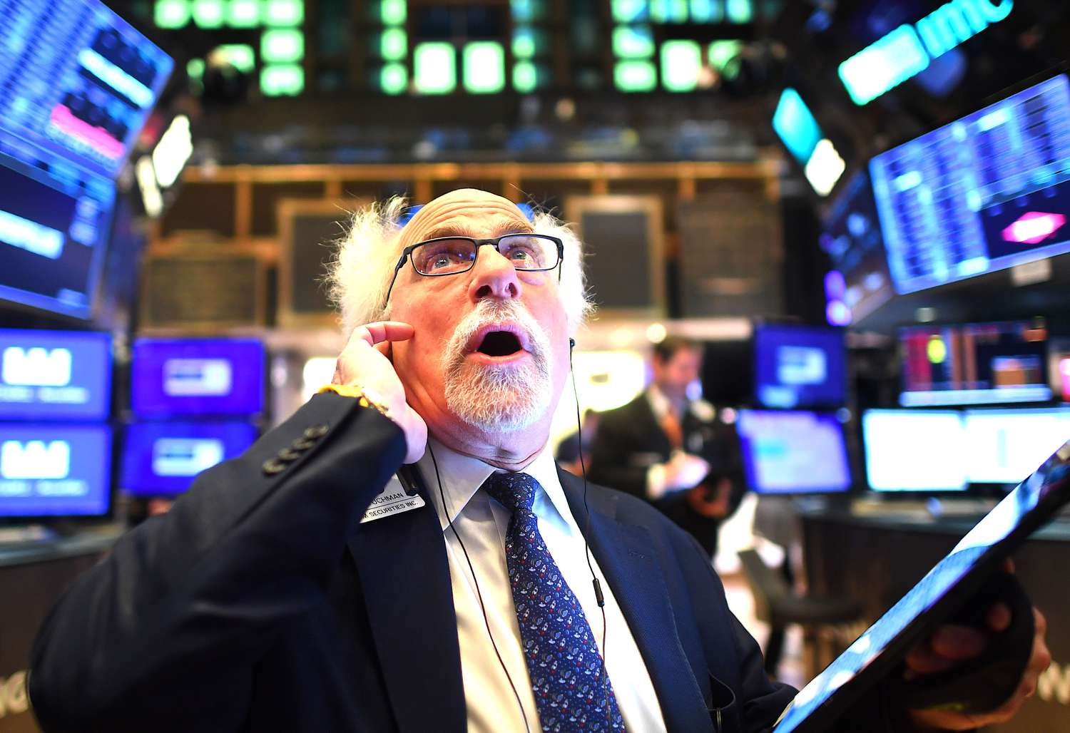 Trader looking at changing prices on the stock exchange.