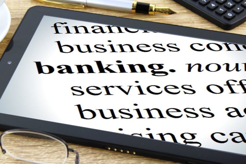 Definition of banking displayed on a tablet.