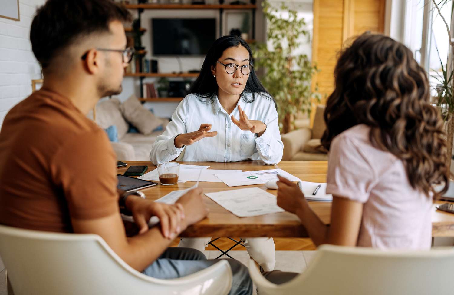 A young couple talks with a financial expert.