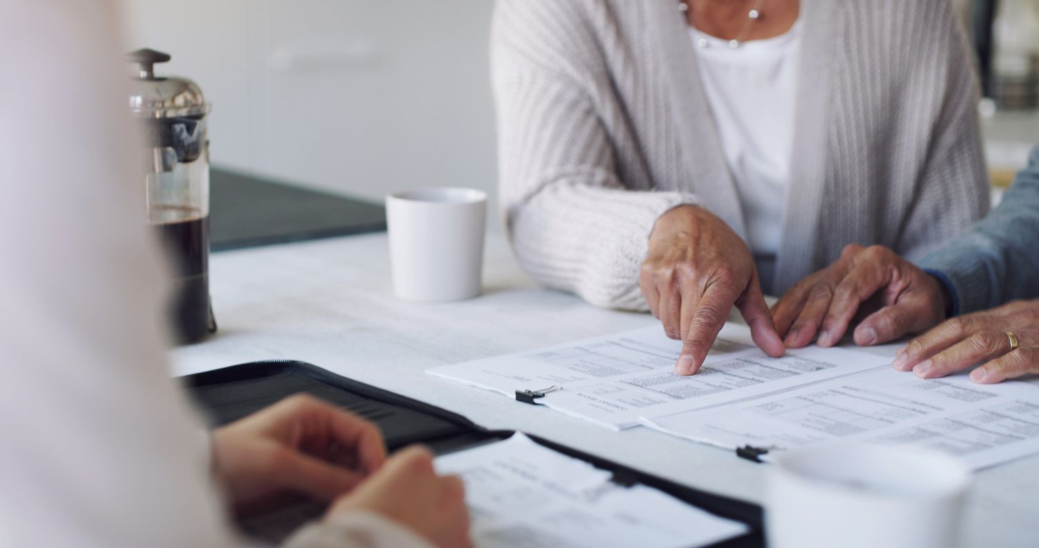 Elderly couple going over financial documents