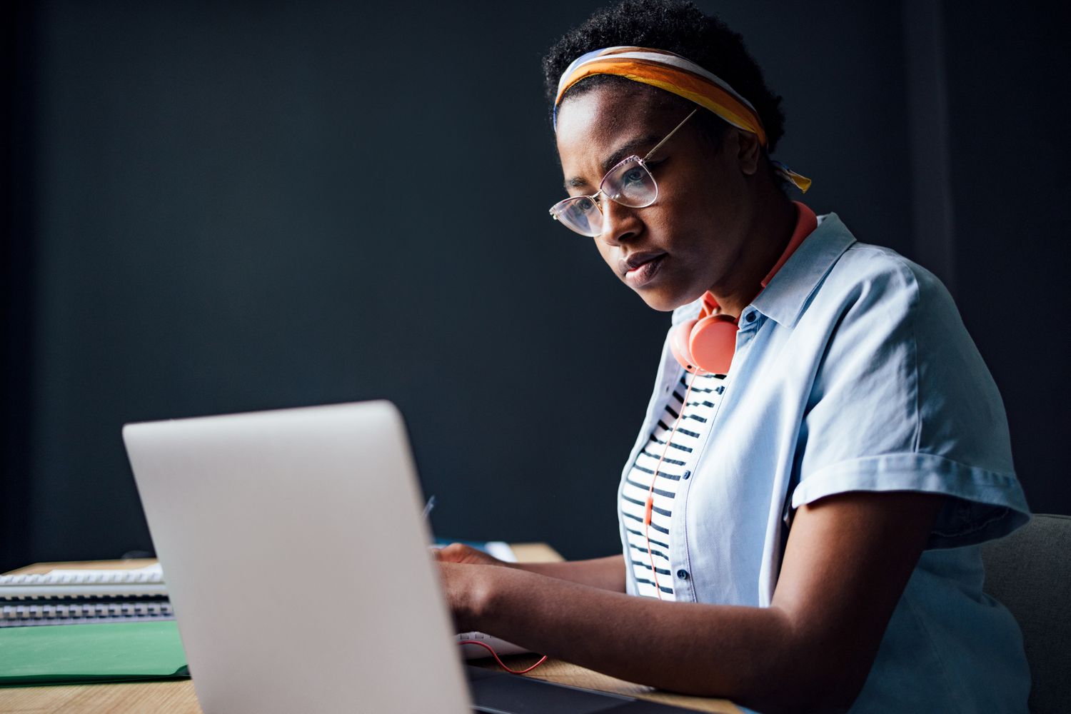 Young black woman studying laptop