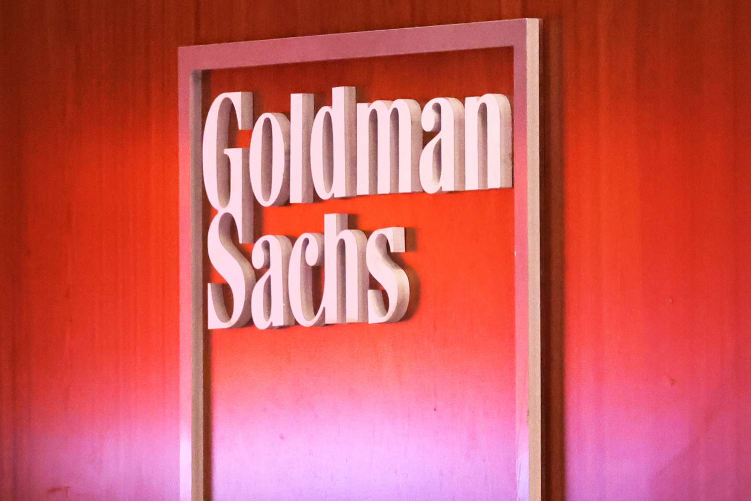 Goldman Sachs logo on an office wall