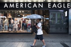 A man walks past an American Eagle store in Hong Kong in May. 