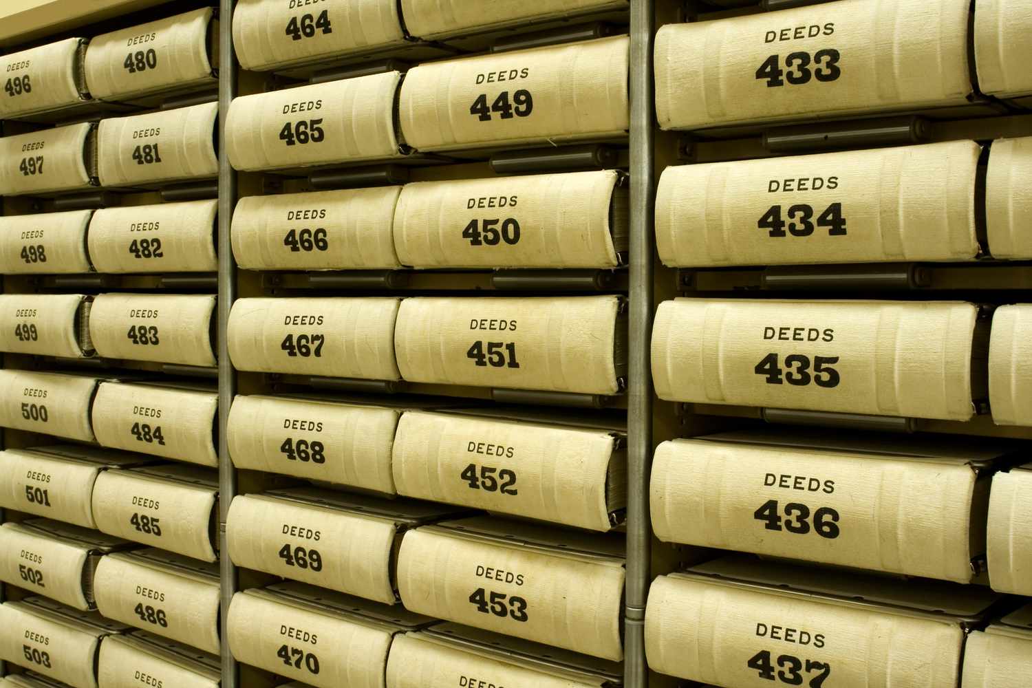 A shelf full of numbered deeds