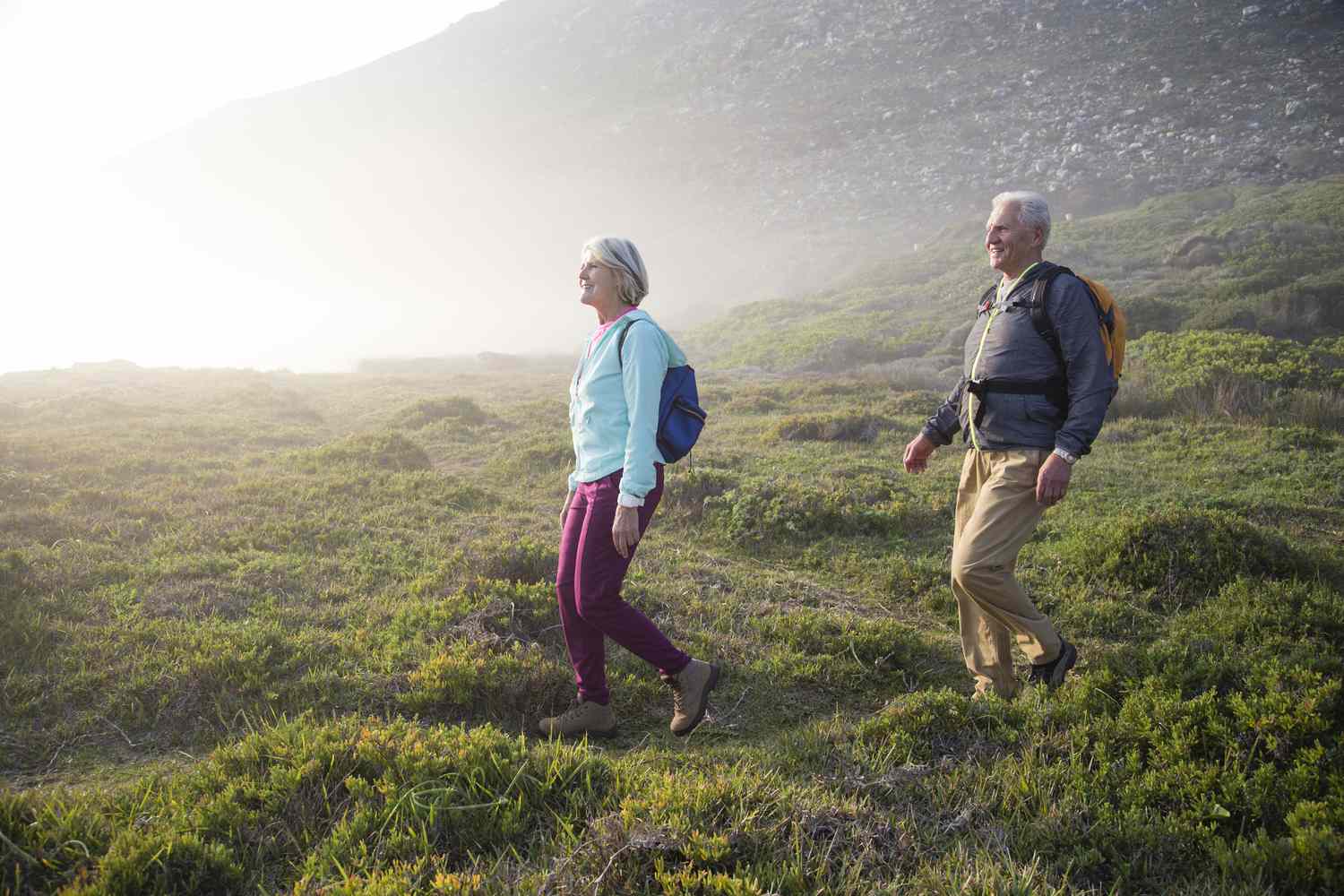 An older couple takes a hike.