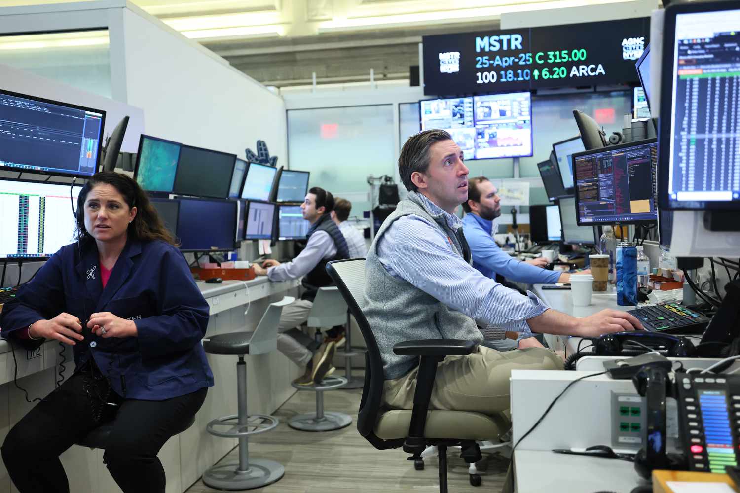 Traders work on the floor of the New York Stock Exchange during morning trading on April 22, 2025 in New York City. 