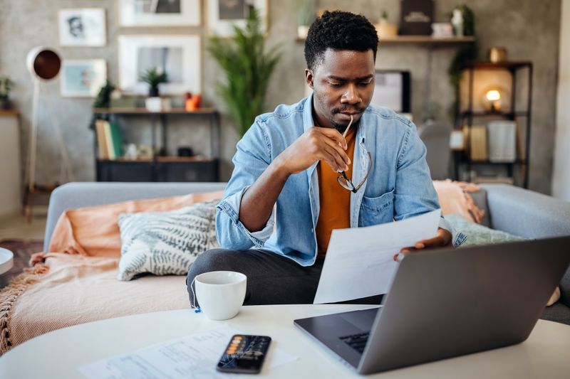 Man looking at credit report