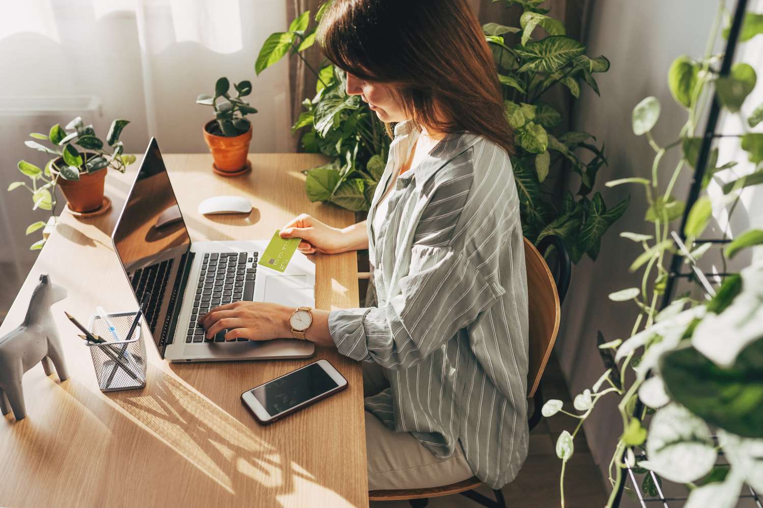Woman using her credit card online