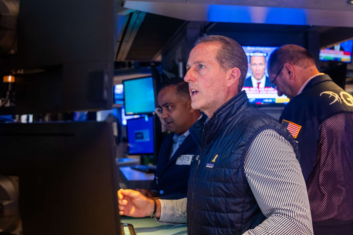 Traders work on the floor of the New York Stock Exchange.