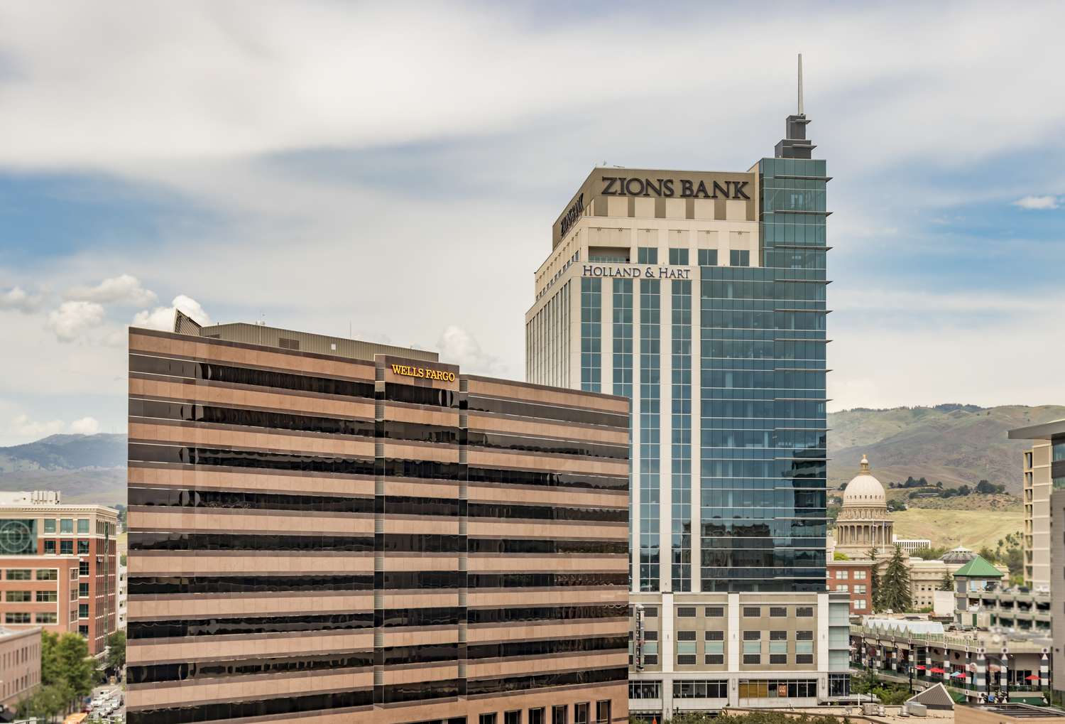 Downtown Boise Financial District Skyscrapers and the State Capital Building. Zions Bank and Wells Fargo towers on a summer afternoon.