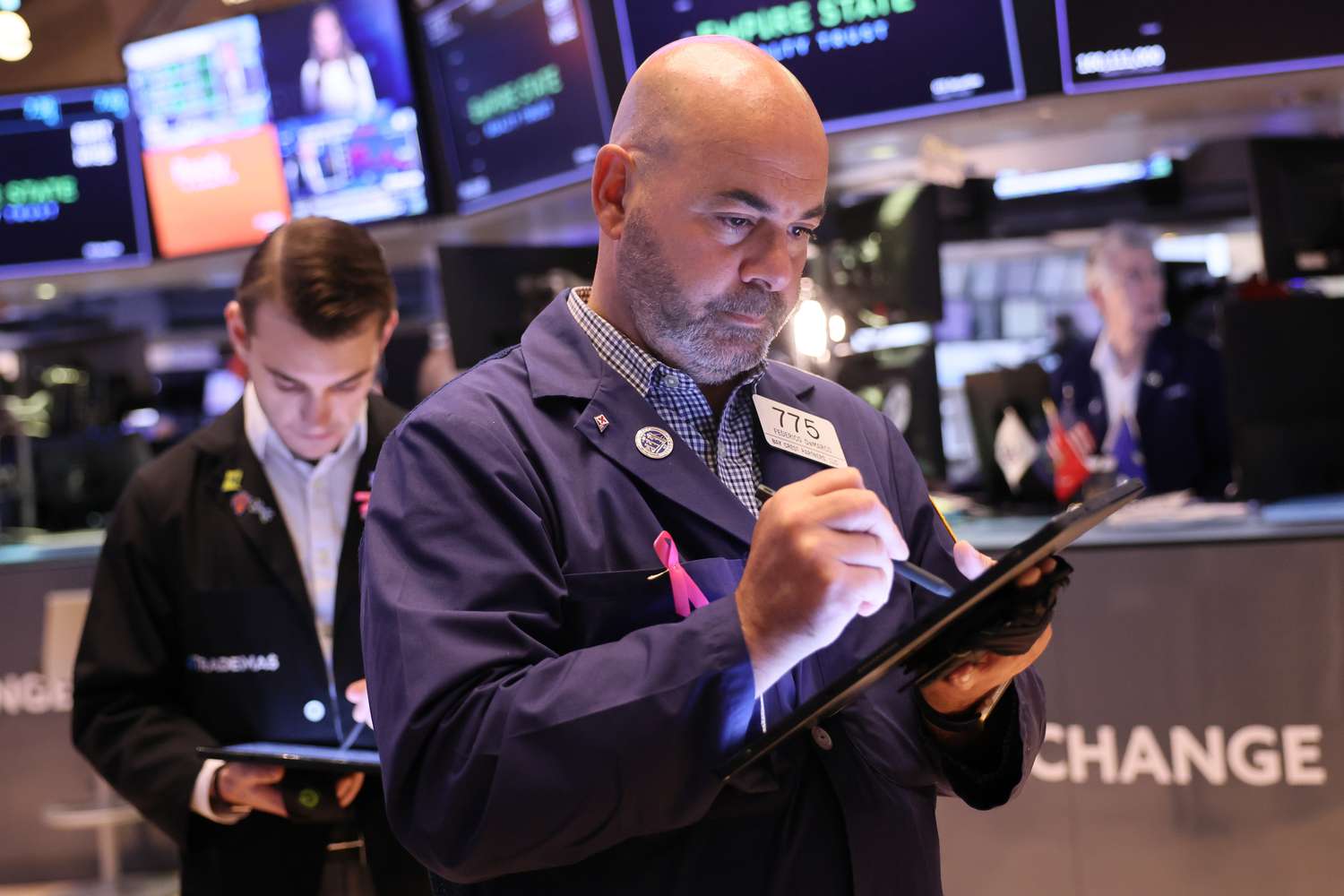 Traders work on the floor of the New York Stock Exchange