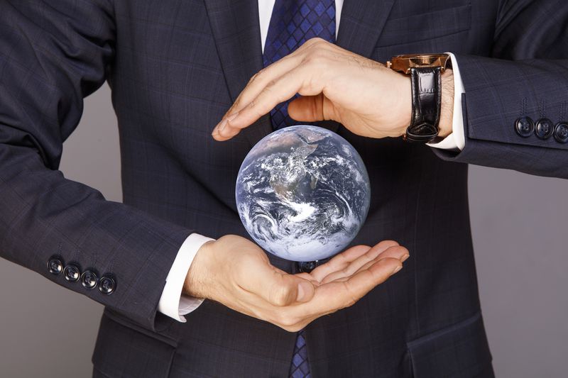 Blue planet Earth in Businessman hands