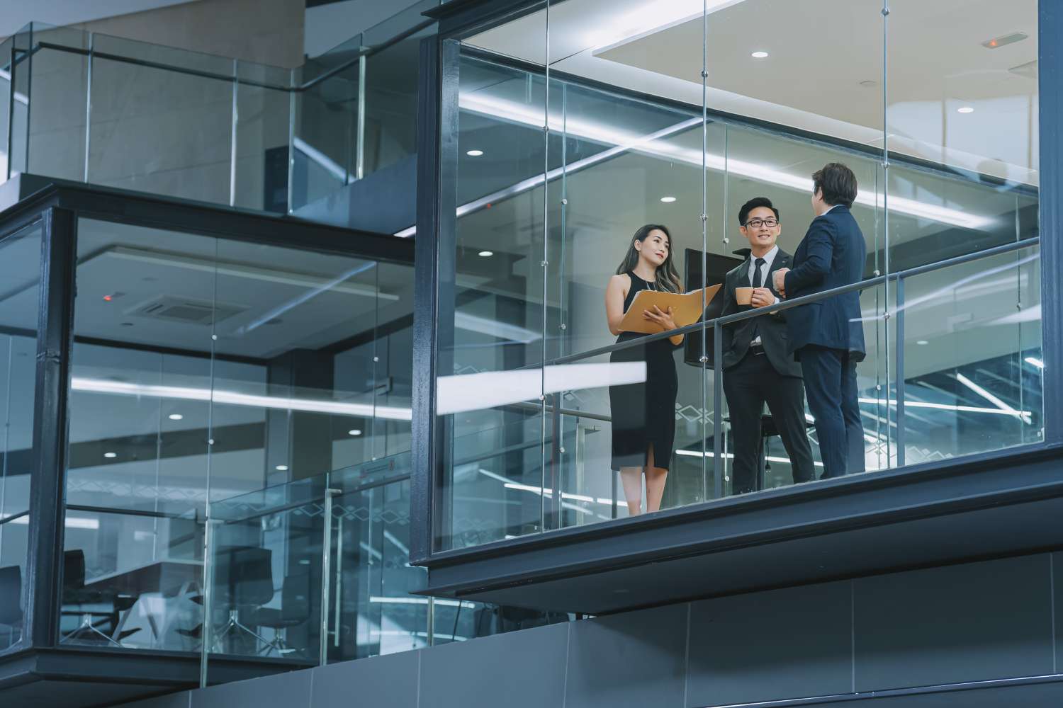 Three business people talking