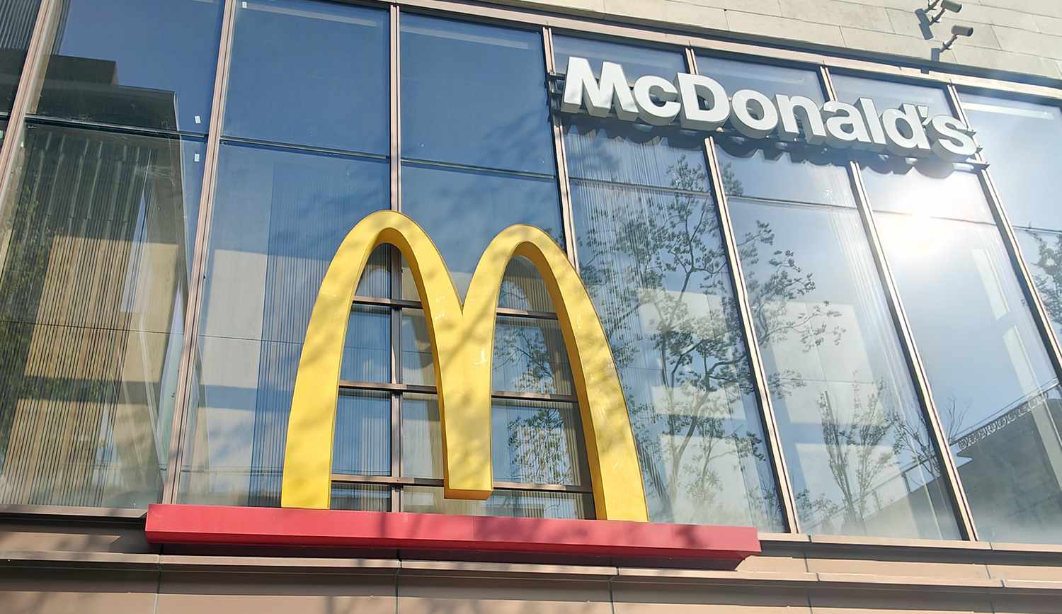 The McDonald's logo is seen on the window of a restaurant in China,