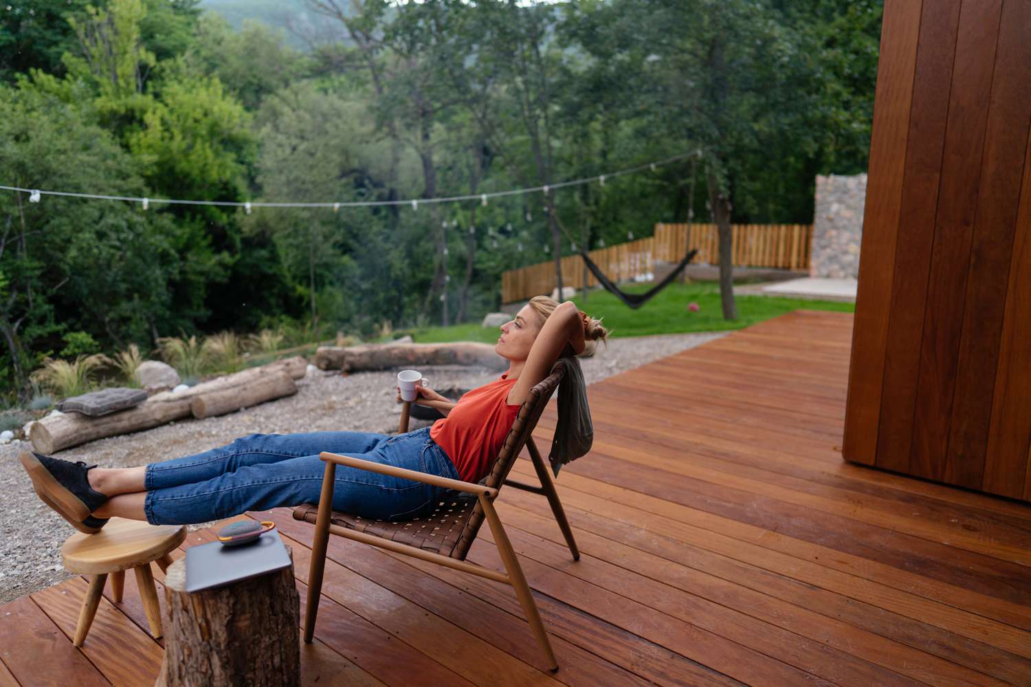A woman relaxing on a deck chair