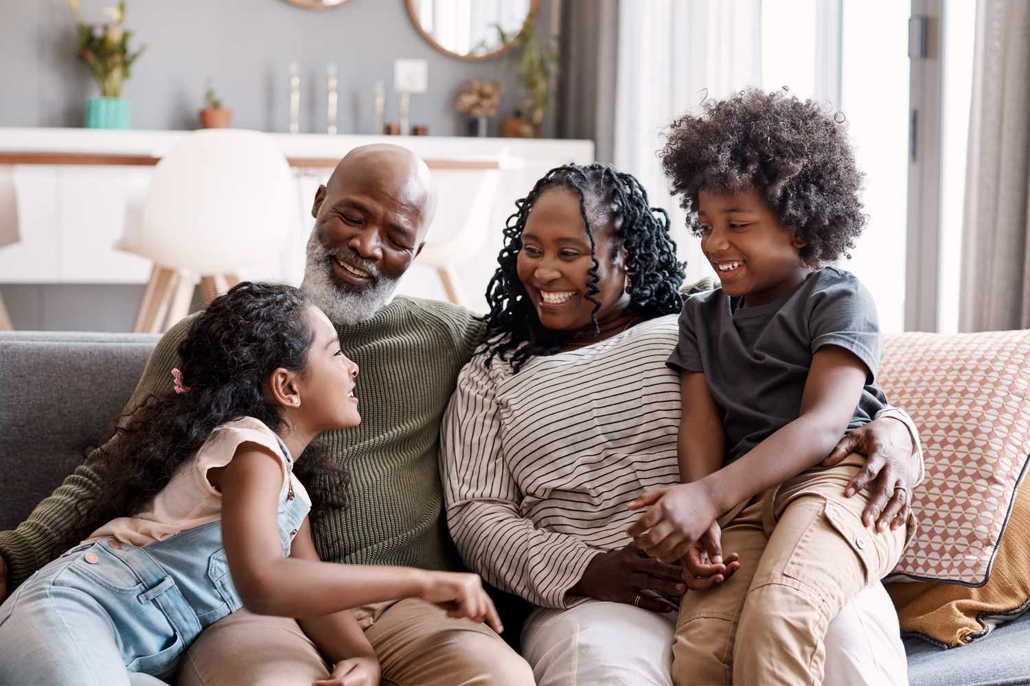 Older adults with children on a couch