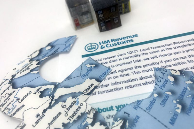 Houses, a map and a HMRC Stamp Land Duty Tax form