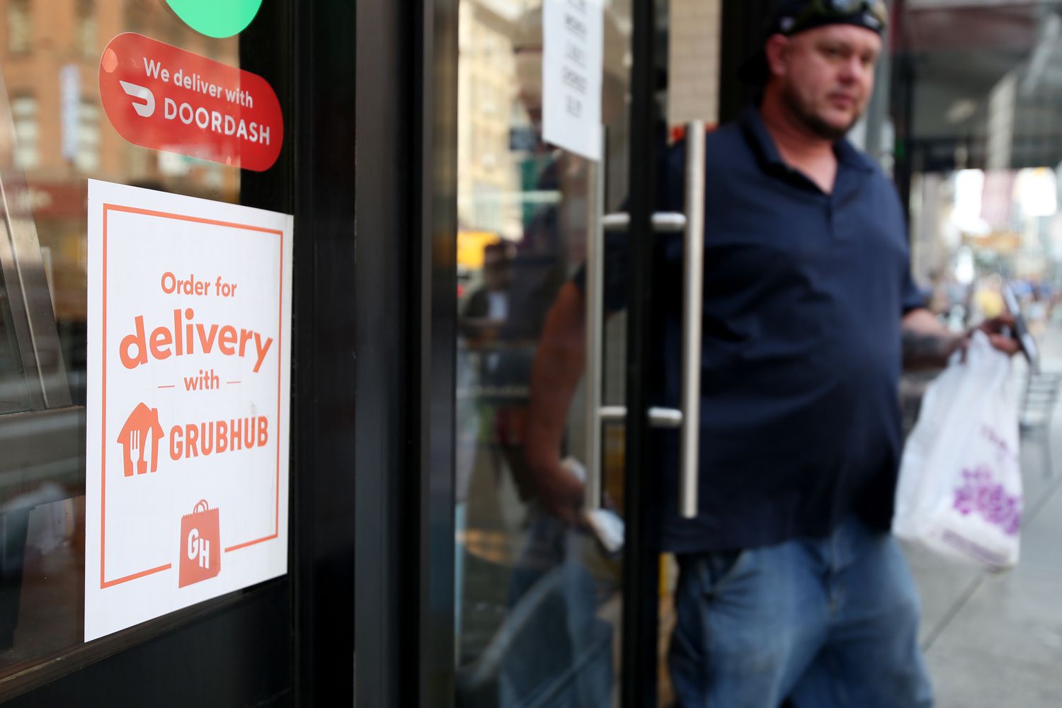 A Grubhub sign is displayed on a store front on July 07, 2023 in New York City