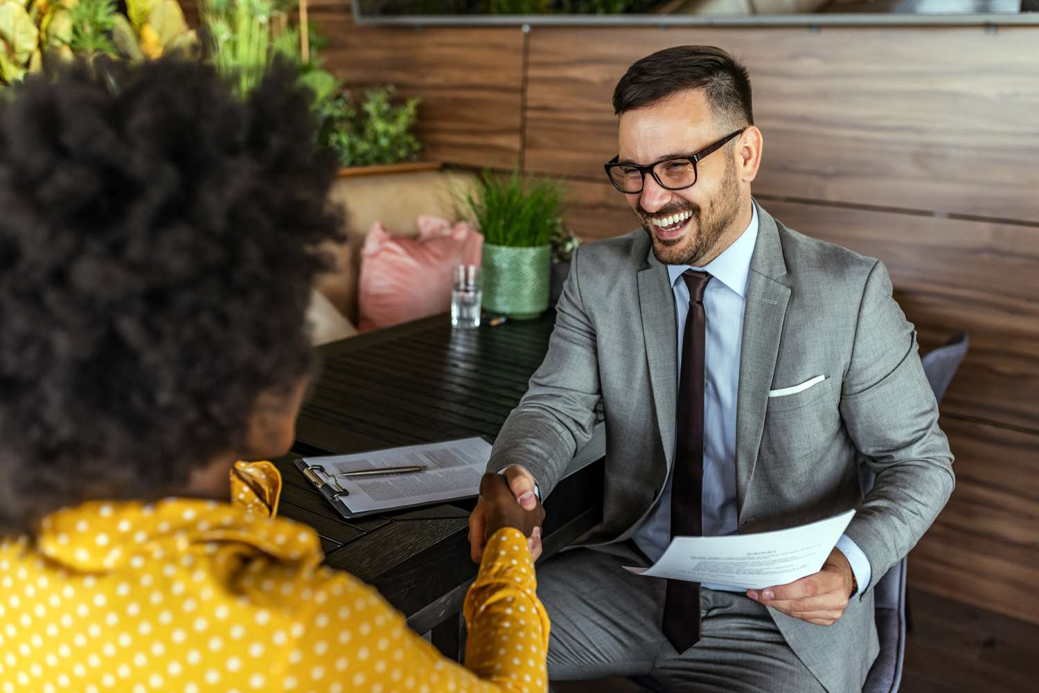 Two business people shaking hands
