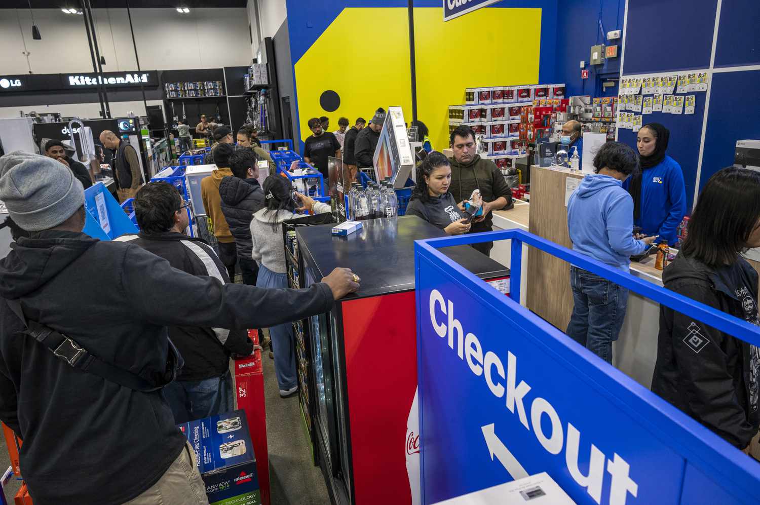 Shoppers in checkout line at a Best Buy store