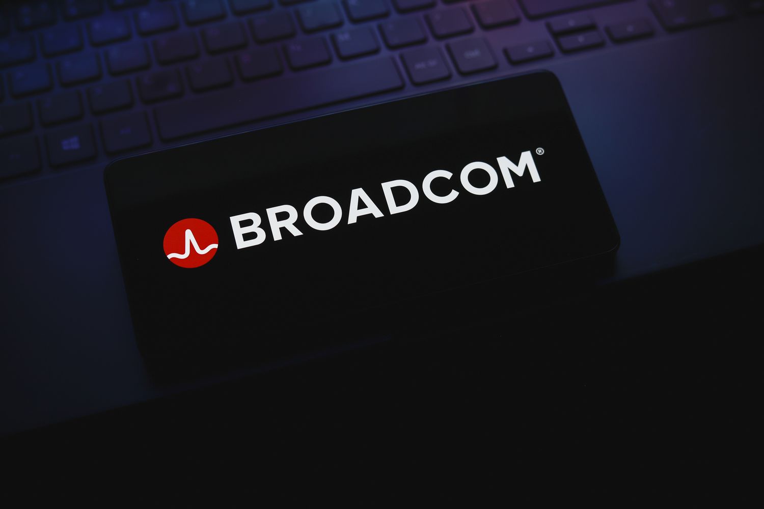 Broadcom Inc. logo is displayed on a smartphone screen