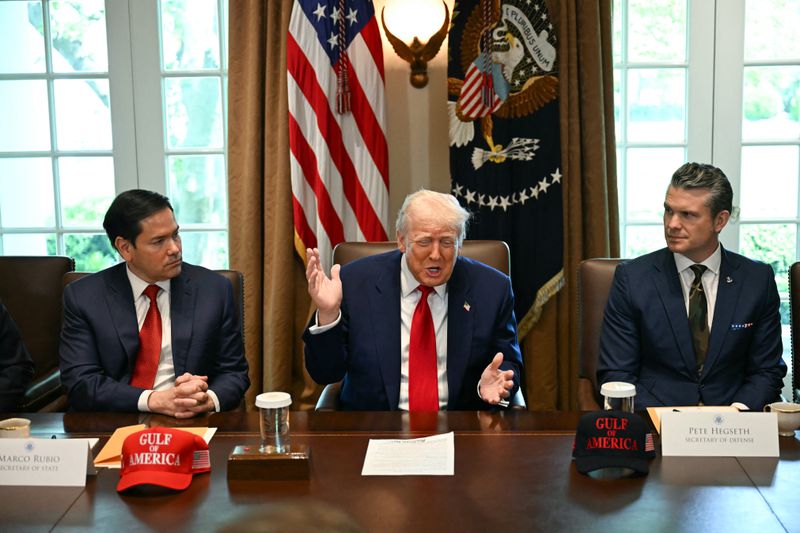 US President Donald Trump, flanked by Secretary of State Marco Rubio (L) and Defense Secretary Pete Hegseth (R), speaks during a cabinet meeting in the Cabinet Room of the White House in Washington, DC, on April 30, 2025. 