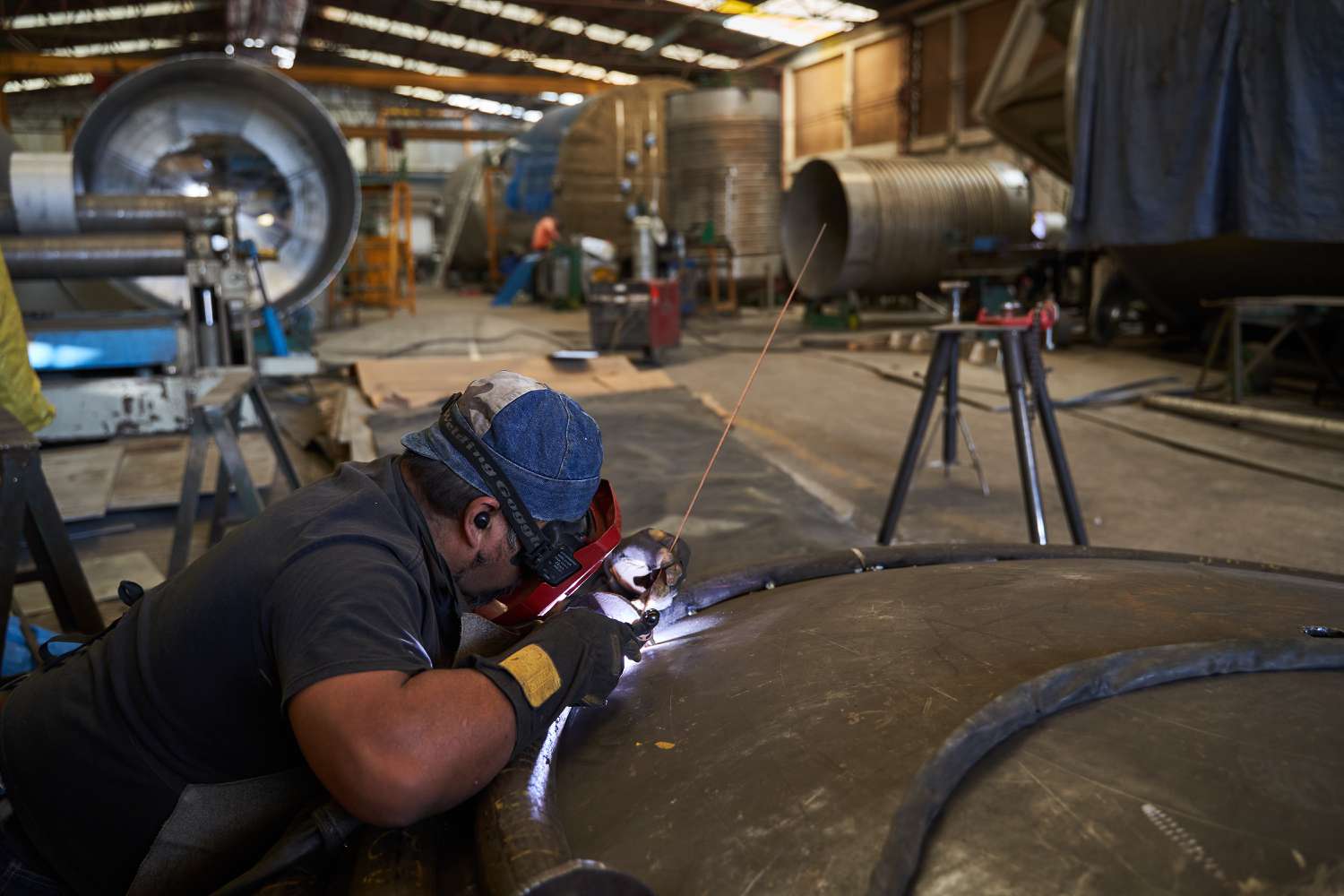 A worker welds a stainless steel part at a steel manufacturing facility in Mexico City, Mexico, on Thursday, Feb. 6, 2025. 