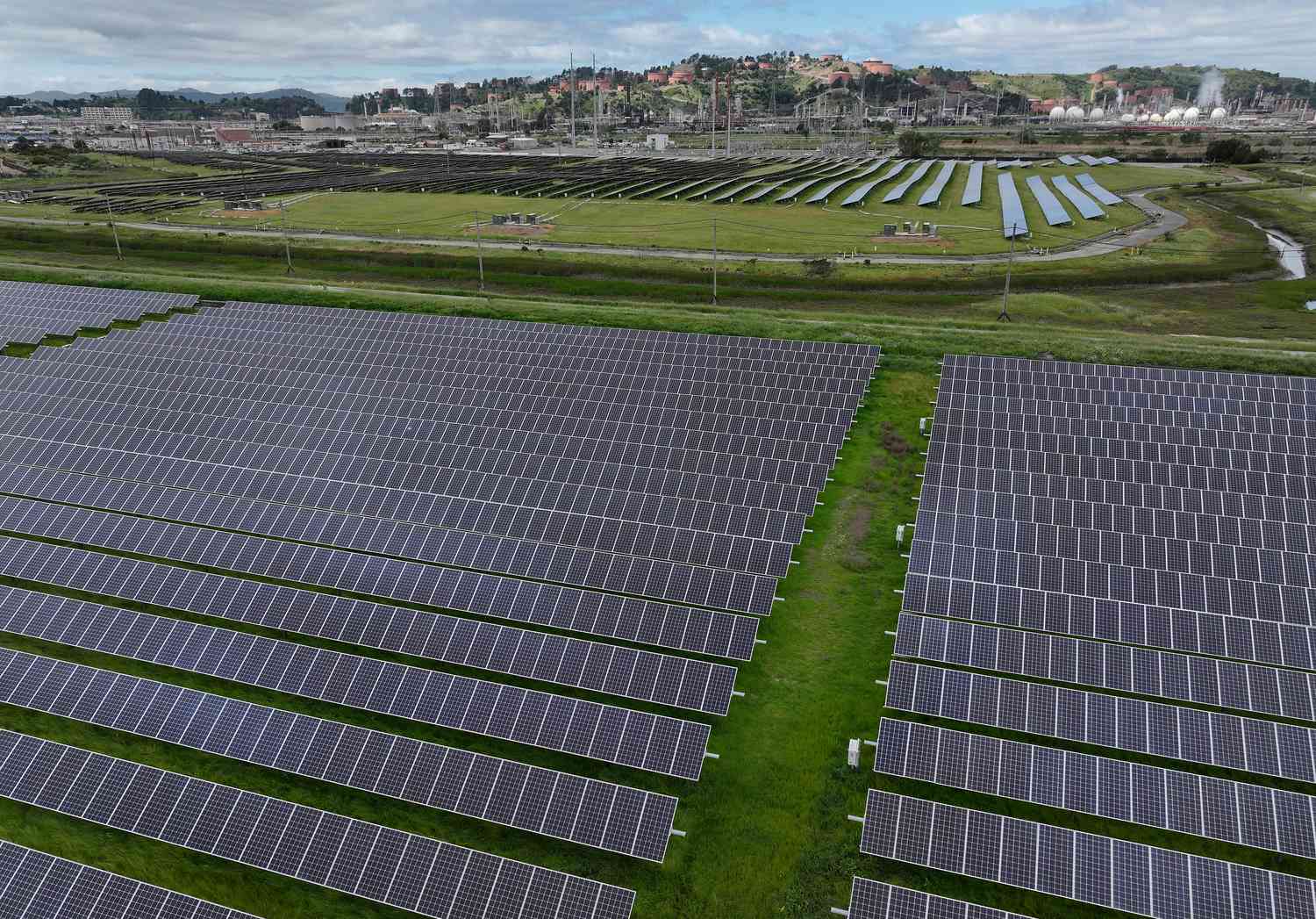 In an aerial view, solar panels are seen at a solar farm in Richmond, California