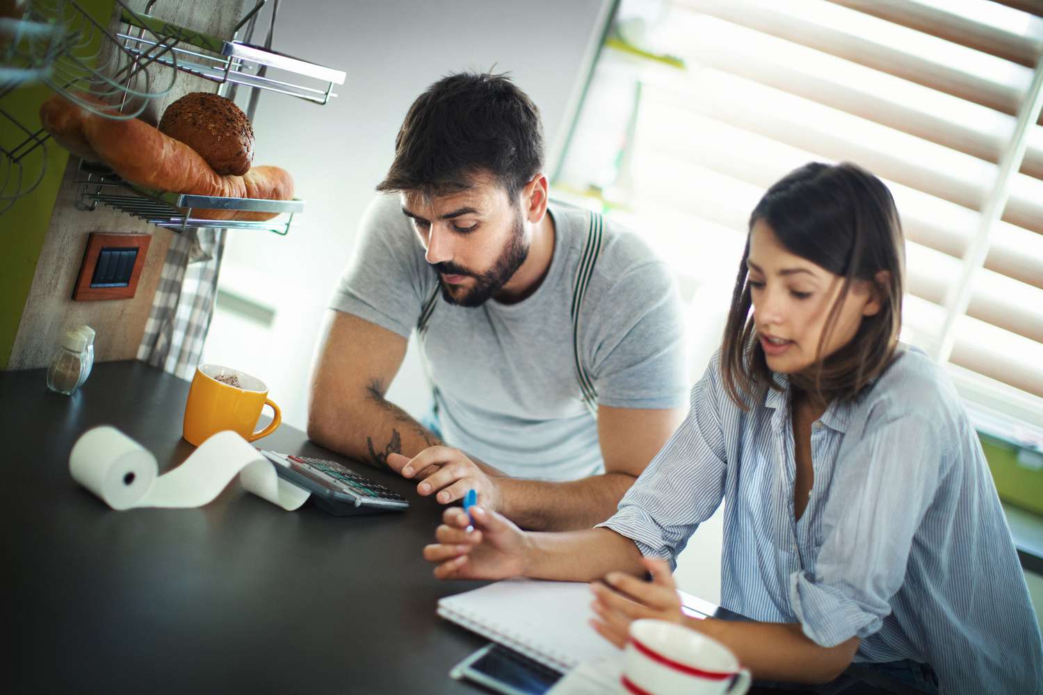Couple reviewing debts