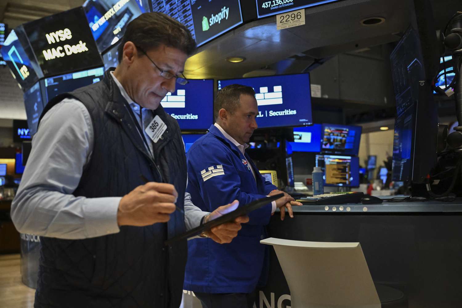 Traders work on the floor of the New York Stock Exchange 