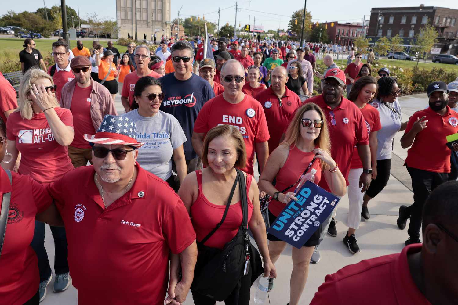 hawn Fain, president of the United Auto Workers (UAW), center, marches with UAW members and supporters during a Labor Day parade in Detroit, Michigan, US, on Monday, Sept. 4, 2023. The UAW's 150,000 members are threatening a strike on General Motors, Ford Motor Co. and Stellantis NV, maker of the Jeep and Chrysler brands, if a deal with Detroit's big three legacy carmakers is not reached by a September 14 deadline.