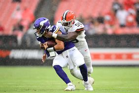 Winston Reid #59 of the Cleveland Browns sacks Jaren Hall #16 of the Minnesota Vikings during the second half of a preseason game at Cleveland Browns Stadium on August 17, 2024 in Cleveland, Ohio